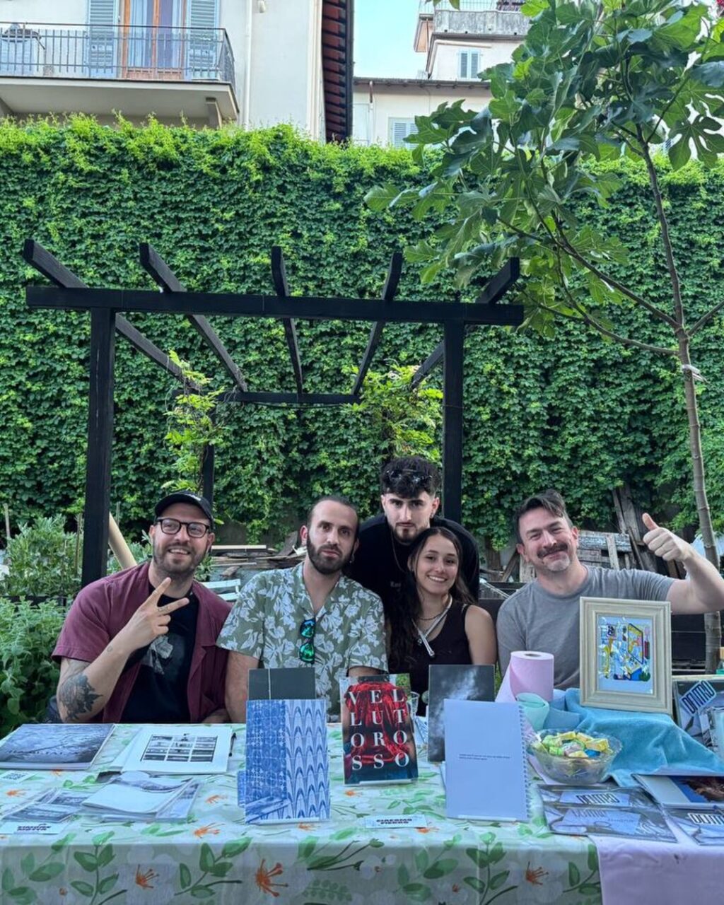 The DENTRO editorial team at their stall at Trame Zine Fest, Orti Dipinti, Florence